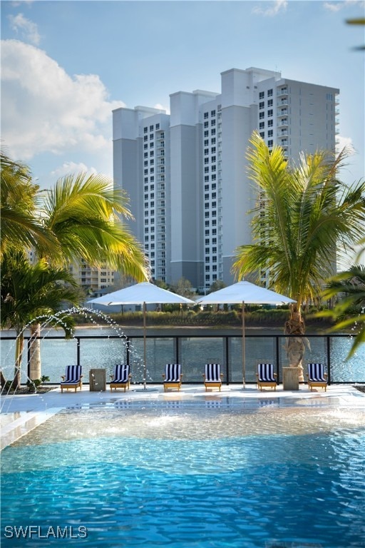 view of pool with a water view