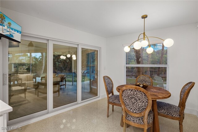 dining space with a notable chandelier