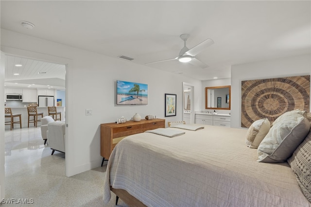 bedroom featuring ceiling fan, vaulted ceiling, and white fridge