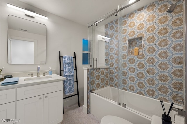 full bathroom featuring bath / shower combo with glass door, vanity, and toilet