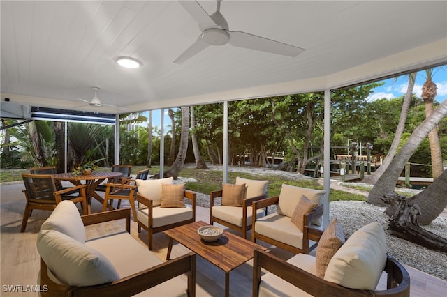 sunroom / solarium with ceiling fan and a healthy amount of sunlight