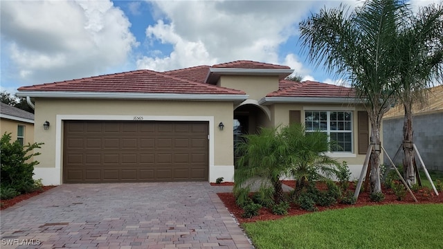 mediterranean / spanish-style home with a garage