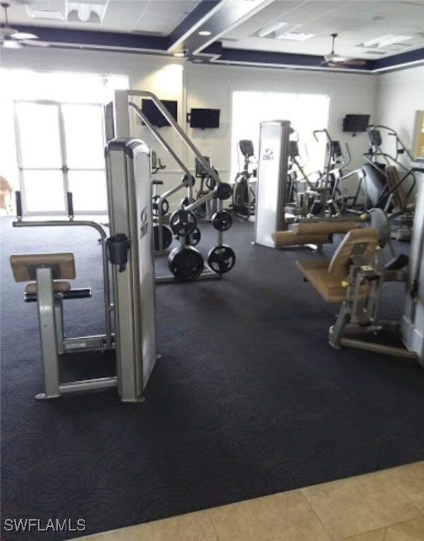 exercise room with ceiling fan