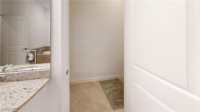 bathroom with tile patterned floors and sink