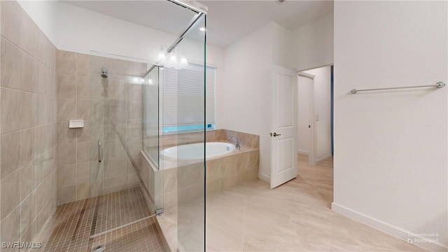 bathroom featuring tile patterned flooring and independent shower and bath