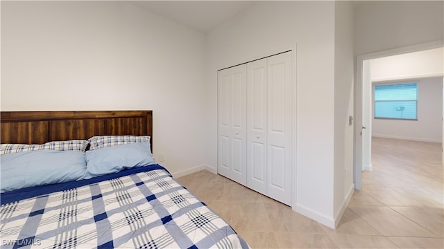 unfurnished bedroom featuring light tile patterned floors and a closet