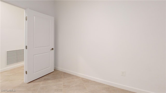 spare room featuring light tile patterned floors