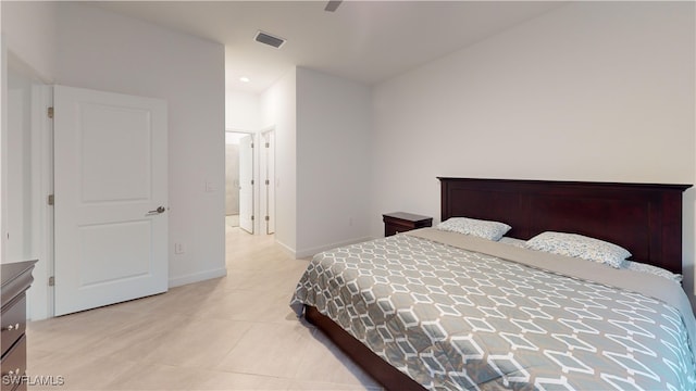 tiled bedroom with ceiling fan