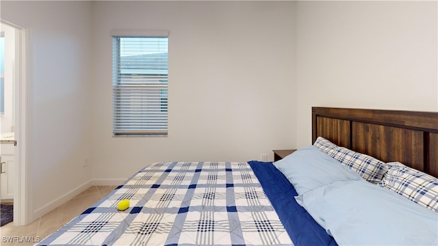 tiled bedroom with connected bathroom