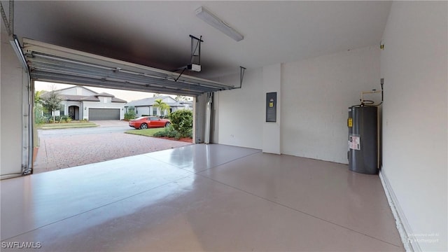 garage with electric water heater and a garage door opener