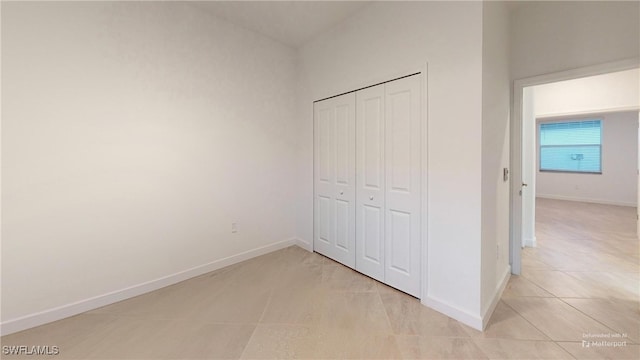 unfurnished bedroom featuring a closet