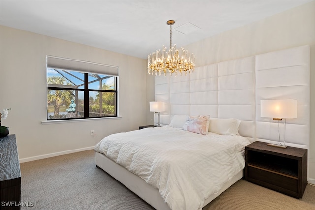 carpeted bedroom featuring a chandelier