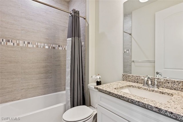 full bathroom with vanity, shower / tub combo, and toilet