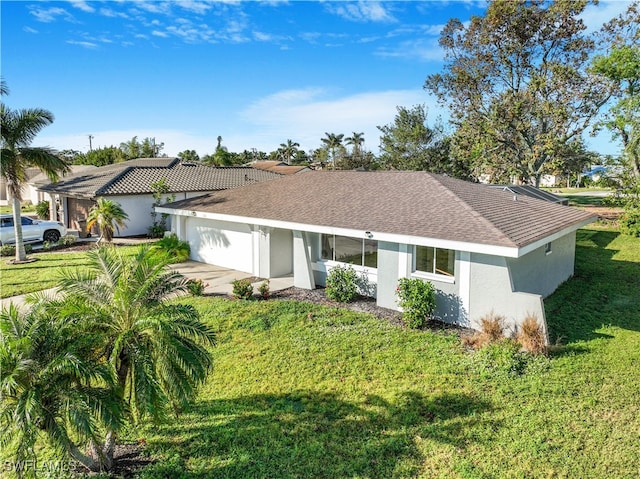 single story home featuring a front yard and a garage