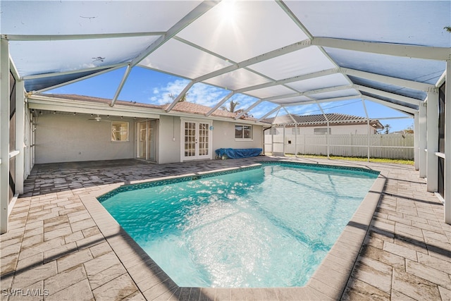 view of pool featuring a patio area, a lanai, and ceiling fan