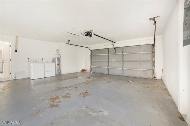 garage featuring a garage door opener, water heater, and independent washer and dryer