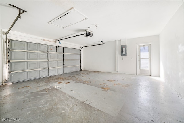 garage featuring electric panel and a garage door opener