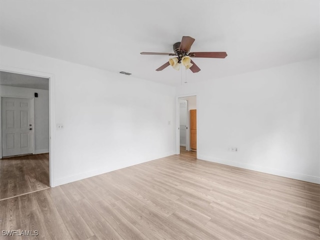 unfurnished room featuring ceiling fan and light wood-type flooring