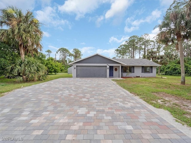 view of front facade featuring a front yard and a garage