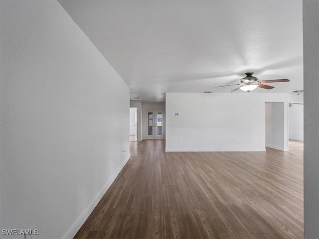 unfurnished room with hardwood / wood-style flooring and ceiling fan