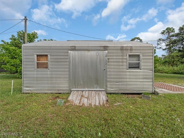 view of outdoor structure with a yard