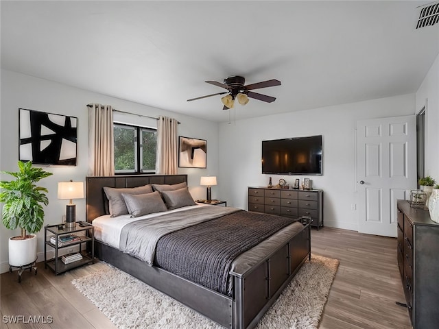 bedroom featuring ceiling fan and wood-type flooring