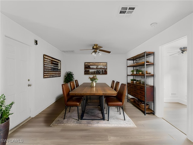 dining room featuring ceiling fan and light hardwood / wood-style flooring