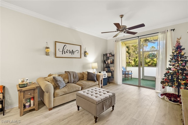 living room featuring crown molding, ceiling fan, and light hardwood / wood-style flooring