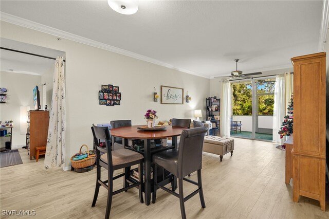 dining area featuring ceiling fan, ornamental molding, and light hardwood / wood-style flooring