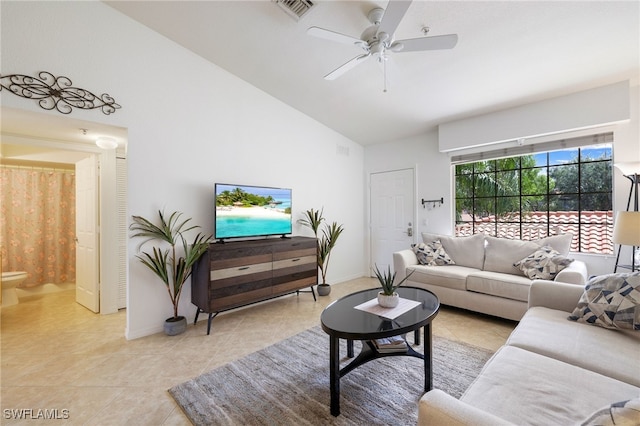 living room with light tile patterned flooring, vaulted ceiling, and ceiling fan