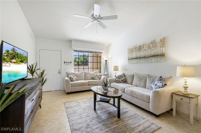 tiled living room featuring ceiling fan