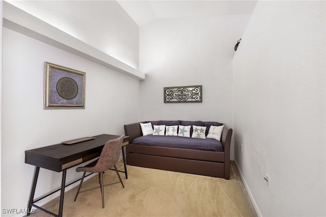 carpeted bedroom with lofted ceiling