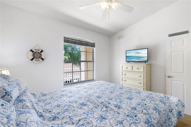 bedroom featuring carpet flooring, vaulted ceiling, and ceiling fan