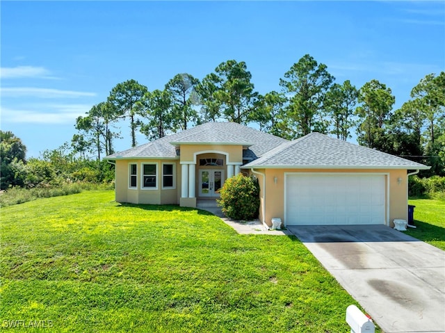 view of front of home with a garage and a front lawn