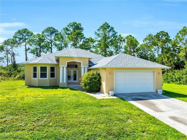 view of front of house with a garage and a front yard