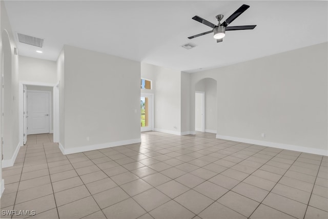 spare room featuring light tile patterned flooring and ceiling fan