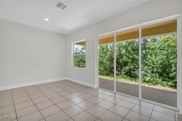 view of tiled spare room