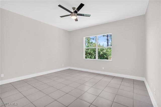 tiled empty room with ceiling fan