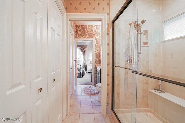 hall with light tile patterned floors