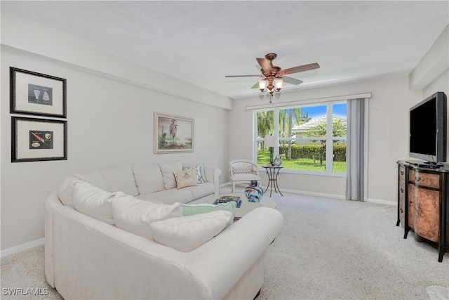 living room with ceiling fan and light carpet