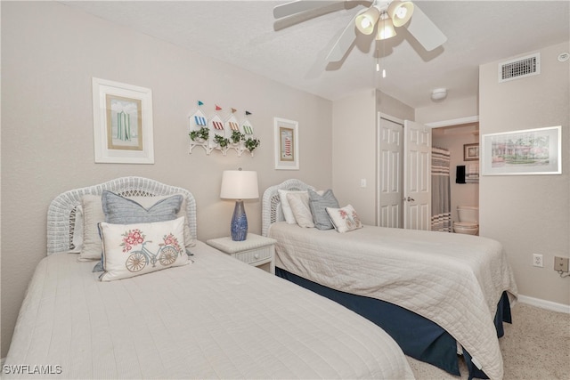 carpeted bedroom with a closet and ceiling fan