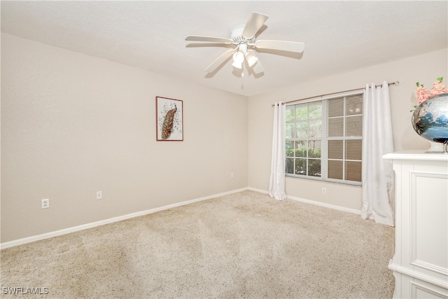 empty room with light carpet and ceiling fan