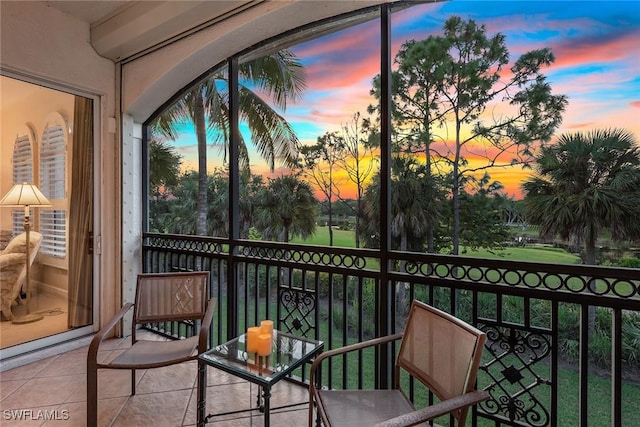 view of balcony at dusk