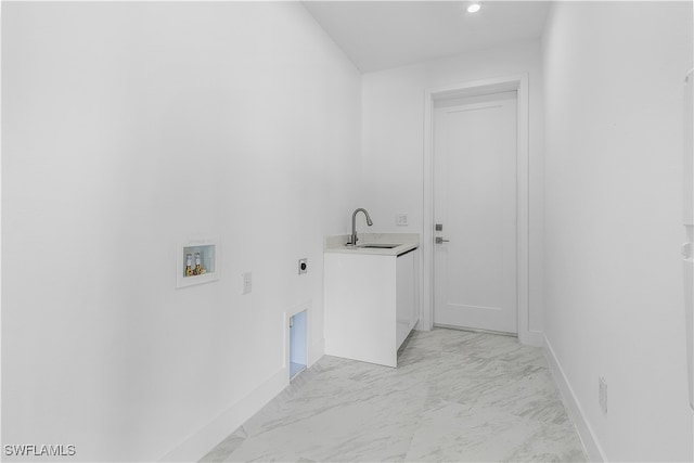 clothes washing area featuring hookup for a washing machine, sink, and electric dryer hookup