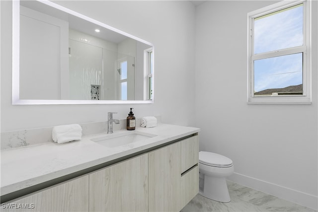 bathroom featuring toilet, walk in shower, and vanity