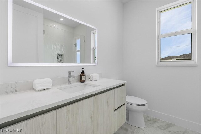 216 Chiquita Blvd N, Cape Coral, FL 33993 - bathroom featuring vanity, marble look tile flooring, toilet, baseboards, and a shower