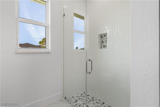 bathroom featuring walk in shower