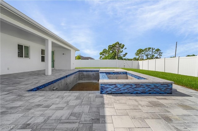 216 Chiquita Blvd N, Cape Coral, FL 33993 - view of swimming pool with a fenced backyard, a patio area, and a hot tub