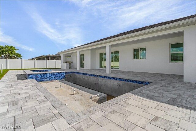 216 Chiquita Blvd N, Cape Coral, FL 33993 - view of pool with a hot tub, a patio area, and a fenced backyard