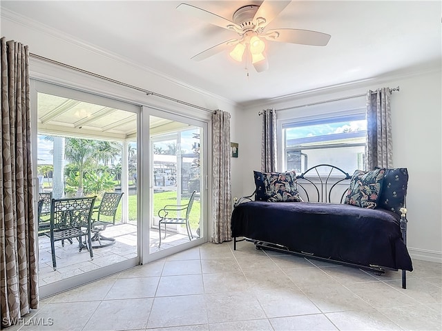 tiled bedroom featuring multiple windows, access to outside, ornamental molding, and ceiling fan